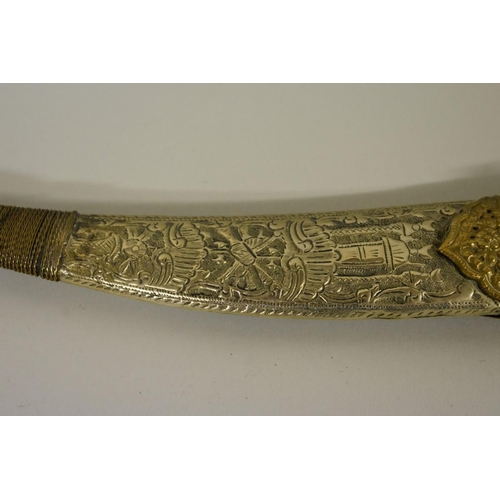 1724 - An Arab jambiya, having pierced 24cm blade, with sheath.