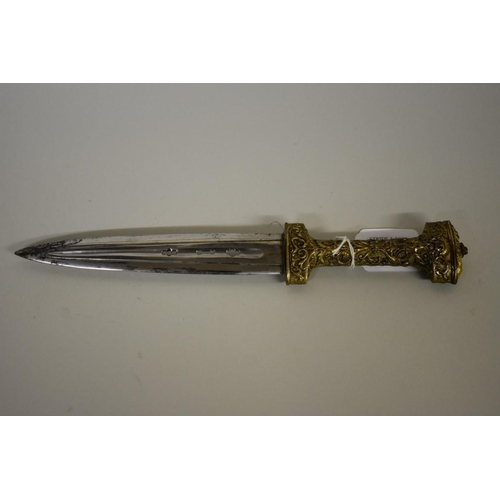 1729 - A rare Spanish Albacete dagger, having pierced 16.5cm blade, with ornate gilt metal handle and scabb... 