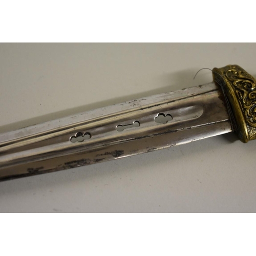 1729 - A rare Spanish Albacete dagger, having pierced 16.5cm blade, with ornate gilt metal handle and scabb... 