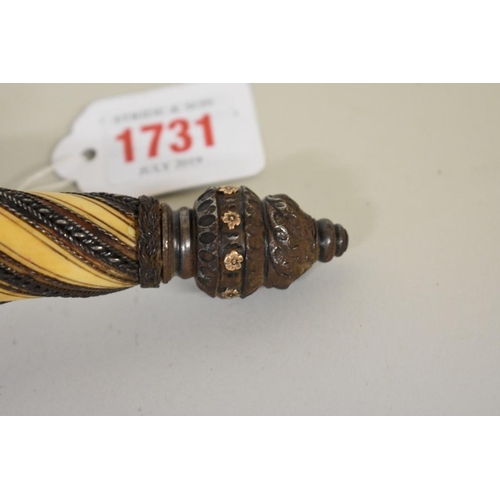 1731 - An unusual 19th century Continental left hand parrying dagger, having 17.5cm wavy blade and applied ... 