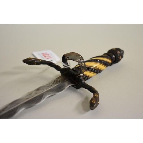 1731 - An unusual 19th century Continental left hand parrying dagger, having 17.5cm wavy blade and applied ... 