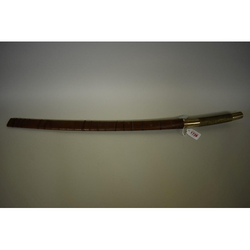 1739 - A Burmese dha, having decorative silver inlaid blade in wood scabbard, 55cm blade.... 