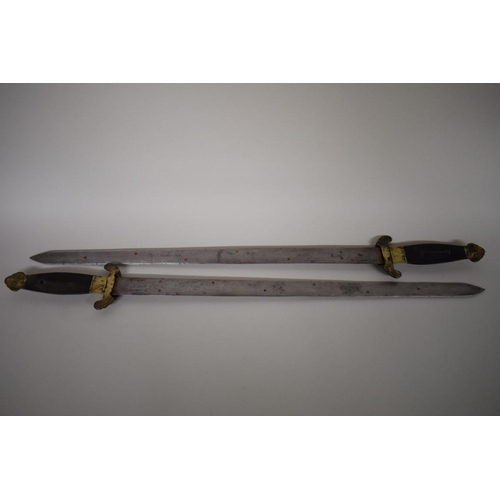 1740 - A pair of Chinese butterfly swords, having 53cm blades with brass mounted shagreen scabbard.... 