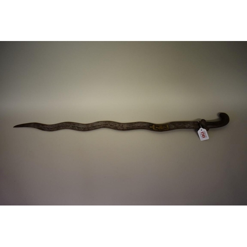 1741 - A North Indian or Nepalese Naga wavy edge blade sword, having 73cm blade, no scabbard.... 