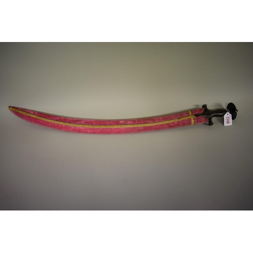 1742 - An antique Indo-Persian Tulwar sword, having 68cm blade, in later scabbard.