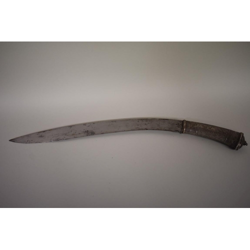 1748 - A Nepalese Sirupate khukuri, having ornate white metal handle and white metal mounts to scabbar... 