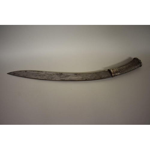 1748 - A Nepalese Sirupate khukuri, having ornate white metal handle and white metal mounts to scabbar... 