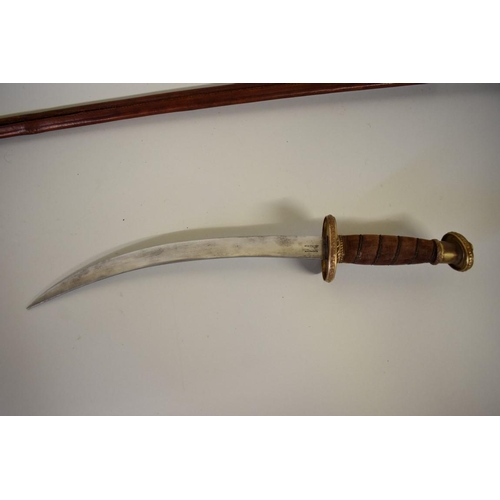 1752 - A theatrical dagger and sheath, by White's; together with another triangular blade sword and scabbar... 