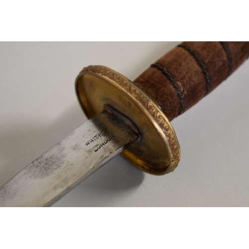 1752 - A theatrical dagger and sheath, by White's; together with another triangular blade sword and scabbar... 