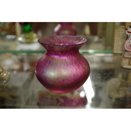 1771 - A Loetz style iridescent glass vase, 7cm high.