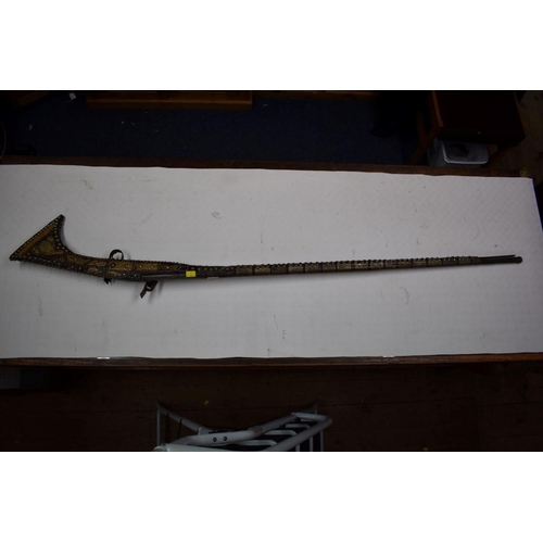 1785 - A decorative Arab flintlock musket, with studded metal and bone stock.