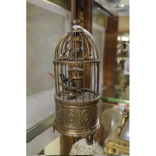 1792 - A brass novelty bird in cage clock, 16cm high.