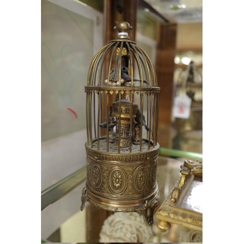 1792 - A brass novelty bird in cage clock, 16cm high.