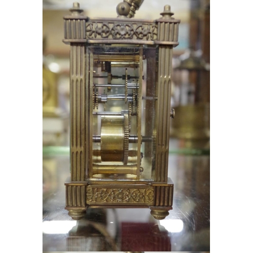 1795 - An old brass carriage timepiece, height including handle 15.5cm.