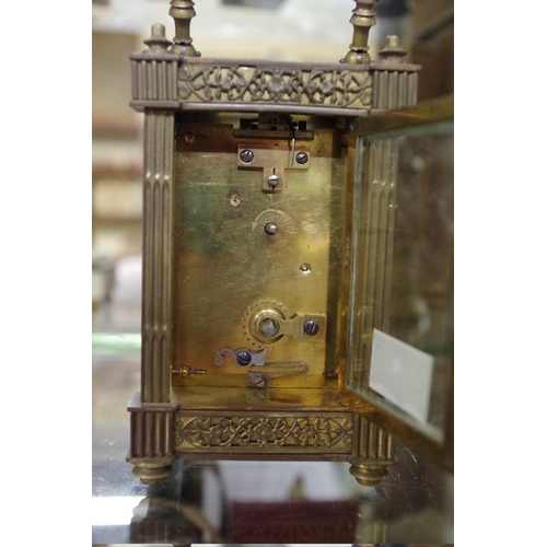 1795 - An old brass carriage timepiece, height including handle 15.5cm.