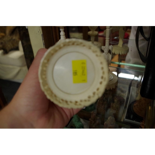 1797 - Two Chinese ivory concentric puzzle balls on stands; together with another Chinese carved ivory vase... 