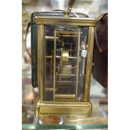 1798 - An old brass carriage clock, with bell striking alarm, height including handle 16.5cm, with ori... 