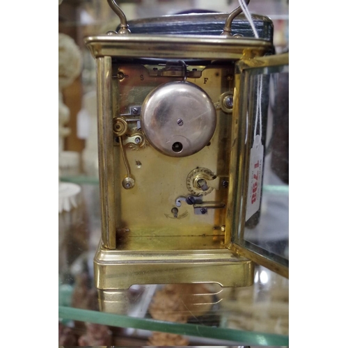 1798 - An old brass carriage clock, with bell striking alarm, height including handle 16.5cm, with ori... 