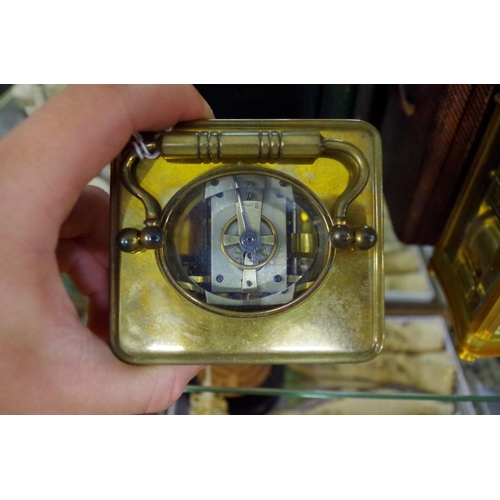 1798 - An old brass carriage clock, with bell striking alarm, height including handle 16.5cm, with ori... 