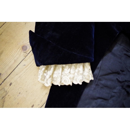 1827 - An early 19th century gentleman's navy blue velvet suit, comprising tail coat with lace cuffs, ... 