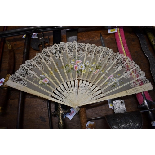 1833 - A bone and lace fan, the guards 35cm long, in card box. 