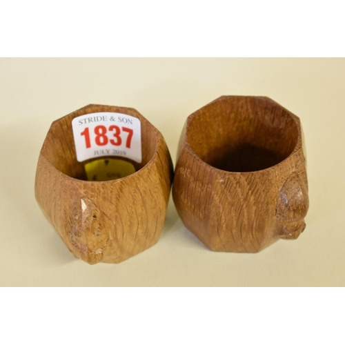 1837 - A pair of Robert 'Mouseman' Thompson oak octagonal napkin rings, 5cm.