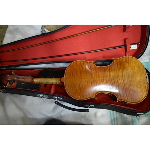 1876 - An antique Continental violin, with 14in two piece back, with two bows and case; together with anoth... 