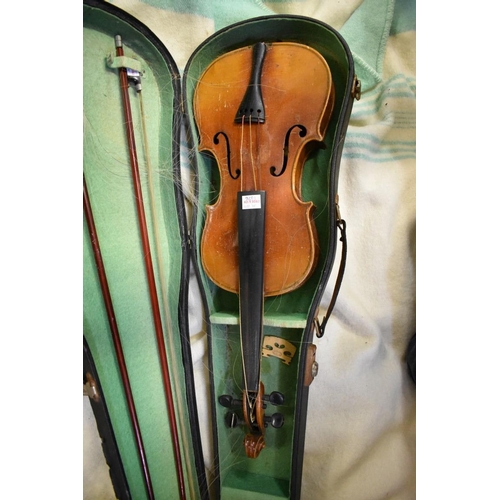 1876 - An antique Continental violin, with 14in two piece back, with two bows and case; together with anoth... 