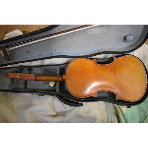 1877 - An antique Continental violin, with 14in two piece back, with bow and case.