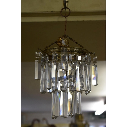 1885 - A brass and faceted glass drop two tier chandelier. 