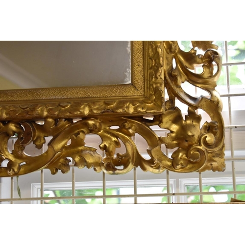 1894 - A 19th century carved gilt wood frame, now enclosing a mirror, the whole 79 x 81cm.... 