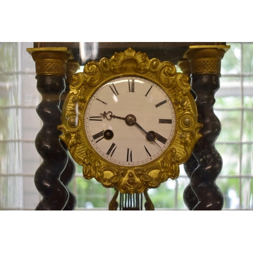 1904 - A late 19th century ebonized and inlaid portico clock, 46.5cm high, with pendulum, on ebonized stand... 