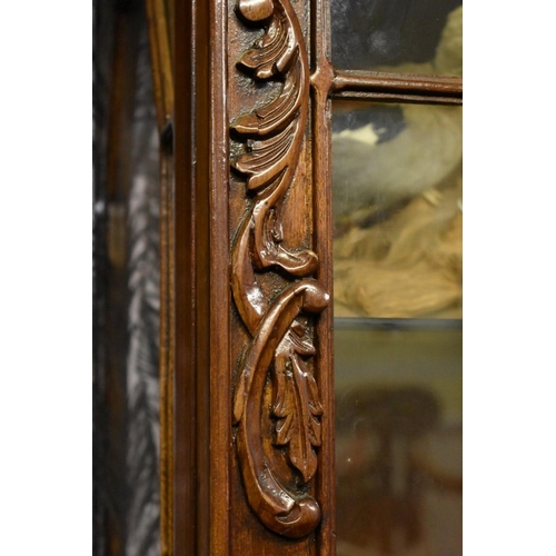 1932 - A reproduction carved hardwood display cabinet, 122cm wide.