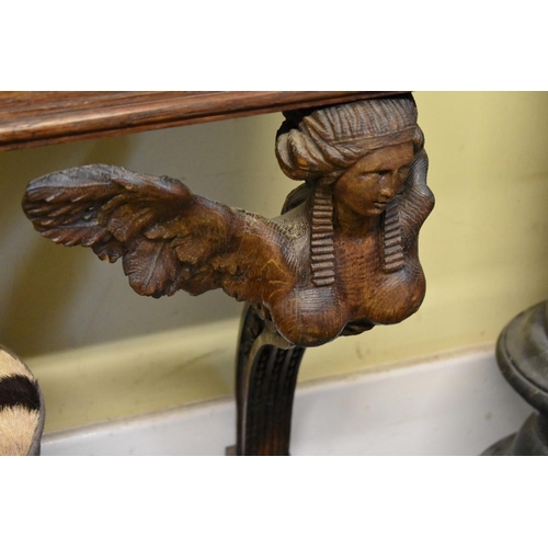 1952 - An antique carved oak and grey marble console table, with figural supports, 101cm wide.... 