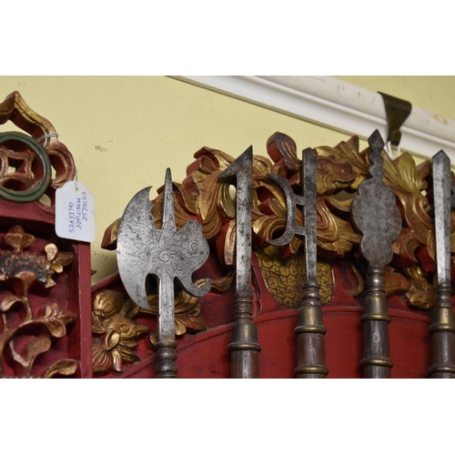 1957 - A Chinese carved wood wall mounted display of nine miniature glaives and pole arms, 84cm wide.... 