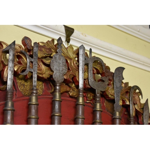 1957 - A Chinese carved wood wall mounted display of nine miniature glaives and pole arms, 84cm wide.... 