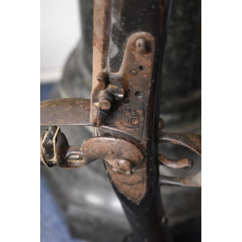 1963 - An Indian flintlock musket, lock decorated elephant and stamped 'Warranted', probably 19th century, ... 