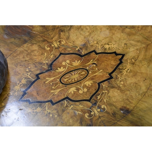 2012 - A Victorian figured walnut and inlaid oval occasional table, 107.5cm wide.