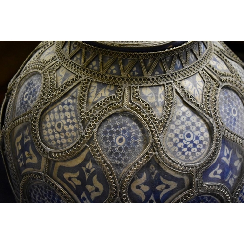 2016 - A near pair of large Persian blue and white temple vases and covers, each with metal mounted decorat... 