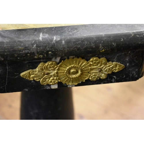 2032 - A specimen marble octagonal table, with brass mounts, 51cm wide.