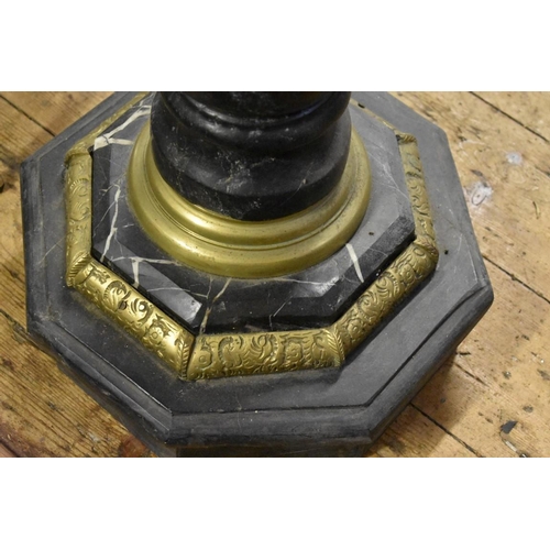 2032 - A specimen marble octagonal table, with brass mounts, 51cm wide.