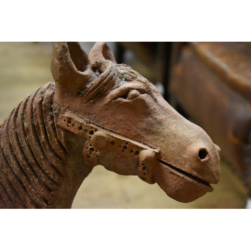 1823 - A Chinese terracotta Tang style figure on horse, 68.5cm high. 