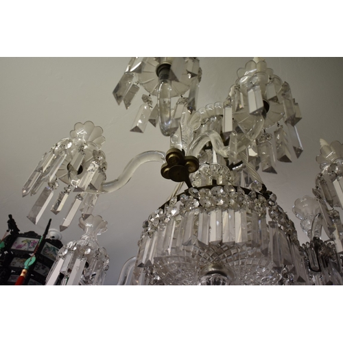 1882 - A large and impressive antique cut and faceted glass nine branch, twelve light chandelier, approx 86... 