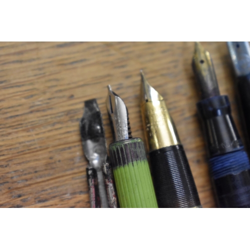 1857 - A quantity of fountain pens and pencils, to include: examples with 14ct nibs.