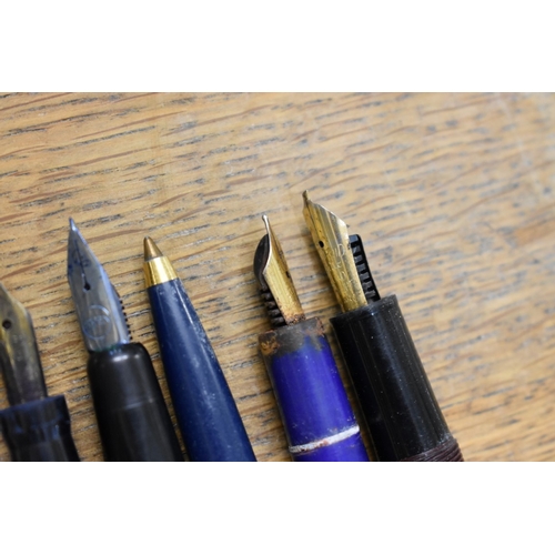 1857 - A quantity of fountain pens and pencils, to include: examples with 14ct nibs.