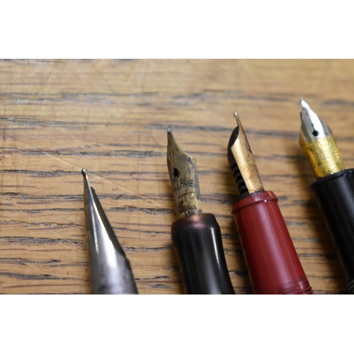 1857 - A quantity of fountain pens and pencils, to include: examples with 14ct nibs.