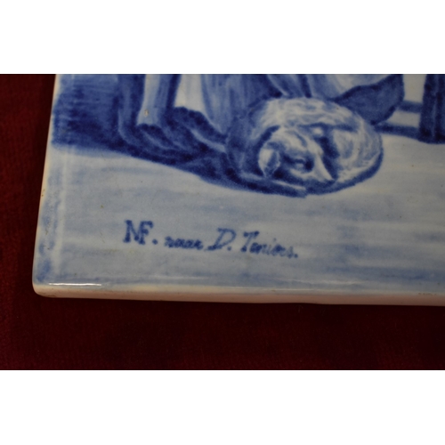 1645 - A Dutch Delft pottery tile, painted with a scene after Teniers, 24.5 x 37cm.