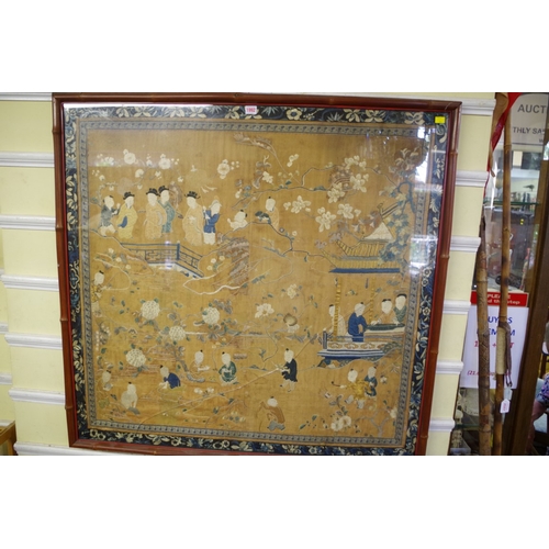 1992 - A Chinese silk embroidered panel, Qing Dynasty, decorated with figures in a landscape, 105 x 109cm.... 