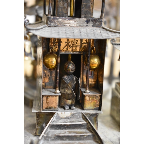 1767 - A Chinese metal pagoda temple, 34cm high.