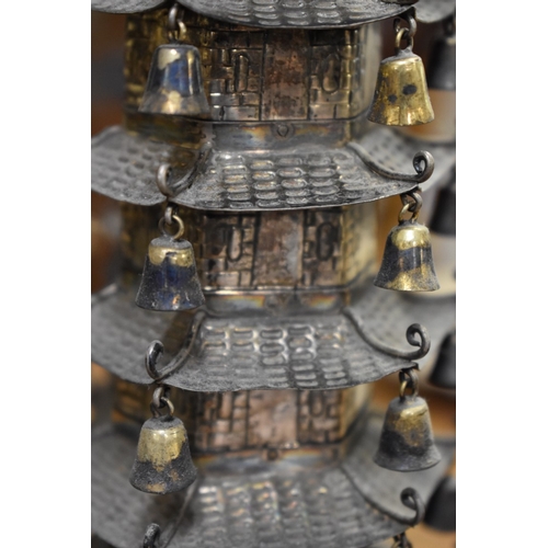 1767 - A Chinese metal pagoda temple, 34cm high.